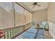 Relaxing covered porch with stylish furniture and comfortable seating at 5775 Monticello Nw Dr, Concord, NC 28027