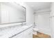 Bathroom featuring a granite countertop, white cabinets and modern fixtures at 601 Westway Dr, Gastonia, NC 28054