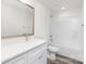 Clean white bathroom featuring a sleek vanity, shower-tub combo, and modern fixtures at 601 Westway Dr, Gastonia, NC 28054