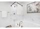 Elegant bathroom featuring a deep soaking tub, marble-style tile, and modern shower fixtures at 601 Westway Dr, Gastonia, NC 28054