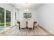 Bright dining room featuring hardwood floors, a large window, and modern decor at 601 Westway Dr, Gastonia, NC 28054