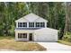 Inviting two-story home features a pristine white facade, black shutters, and a well-maintained front yard at 601 Westway Dr, Gastonia, NC 28054