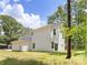 Two-story home with a large backyard and lush green trees at 601 Westway Dr, Gastonia, NC 28054