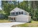 Beautiful two-story home with a two car garage, lovely black shutters, and a well manicured lawn at 601 Westway Dr, Gastonia, NC 28054