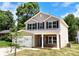 Charming two-story home featuring a well-maintained lawn, brick accents and a two-car garage at 601 Westway Dr, Gastonia, NC 28054