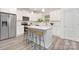 Modern kitchen with stainless steel appliances, white cabinets, and a spacious center island at 601 Westway Dr, Gastonia, NC 28054