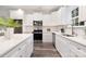 Well-lit kitchen featuring stainless steel appliances, white cabinets, and ample counter space at 601 Westway Dr, Gastonia, NC 28054