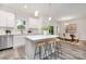 Bright kitchen with white cabinets, stainless steel appliances, and an island with bar seating at 601 Westway Dr, Gastonia, NC 28054
