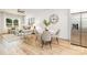 Spacious living room with hardwood floors, a dining area, and stainless steel refrigerator at 601 Westway Dr, Gastonia, NC 28054