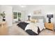 Comfortable main bedroom with large window, decorative pillows, and modern bedside lamps at 601 Westway Dr, Gastonia, NC 28054