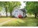 View of a cozy house, nice grassy lawn, mature tree coverage and beautiful landscaping at 602 W 6Th St, Newton, NC 28658