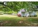 Lush backyard with mature trees, perfect for outdoor activities and relaxation at 602 W 6Th St, Newton, NC 28658
