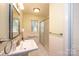 Bathroom with walk in shower, pedestal sink and tile floors at 602 W 6Th St, Newton, NC 28658
