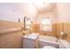 Traditional bathroom featuring a classic sink, bathtub, and neutral-tone tile at 602 W 6Th St, Newton, NC 28658