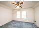 Cozy bedroom illuminated by a stylish ceiling fan and natural light from two windows at 602 W 6Th St, Newton, NC 28658