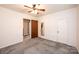 Bedroom with ceiling fan, closet and view into hallway at 602 W 6Th St, Newton, NC 28658