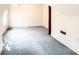 An empty bedroom with blue carpeting and white walls at 602 W 6Th St, Newton, NC 28658