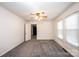 Cozy bedroom featuring neutral carpet and paint and great natural light at 602 W 6Th St, Newton, NC 28658