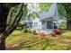 Charming home featuring a covered front porch with seating and beautifully landscaped front yard at 602 W 6Th St, Newton, NC 28658