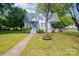 Charming home with a well-maintained lawn, inviting porch, and mature trees offering plenty of shade at 602 W 6Th St, Newton, NC 28658