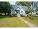 Inviting home with landscaped front yard and covered porch, perfect for enjoying outdoor living at 602 W 6Th St, Newton, NC 28658