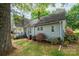 Side view of a traditional home featuring a manicured lawn and mature landscaping, enhancing its charm at 602 W 6Th St, Newton, NC 28658