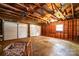 Spacious two-car garage interior with unfinished wood walls and ceiling, ready for customization at 602 W 6Th St, Newton, NC 28658