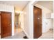 Hallway with vintage wallpaper, carpet and view into other rooms at 602 W 6Th St, Newton, NC 28658