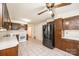 Kitchen featuring tiled floor, stainless steel appliances, and wood cabinets at 602 W 6Th St, Newton, NC 28658