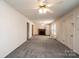Spacious living room with ample natural light and a cozy brick fireplace, ready for your personal touch at 602 W 6Th St, Newton, NC 28658