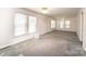 Bright living area featuring natural light and neutral carpet and paint at 602 W 6Th St, Newton, NC 28658