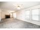 Spacious living room with a fireplace and natural light from two large windows at 602 W 6Th St, Newton, NC 28658
