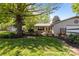 Lush backyard featuring a shed, mature trees, and lush grass at 6325 Yount Dr, Salisbury, NC 28147