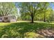 The backyard offers ample green space and mature trees at 6325 Yount Dr, Salisbury, NC 28147