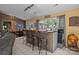 Entertaining bar area with seating, wood paneling, and ample natural light, creating a welcoming space at 6325 Yount Dr, Salisbury, NC 28147