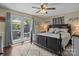 Elegant bedroom with hardwood floors, french doors to outdoor patio, and a plush rug, inviting relaxation at 6325 Yount Dr, Salisbury, NC 28147