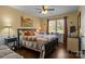 Cozy bedroom with a quilt-covered bed, hardwood floors, and a window view, offering a serene retreat at 6325 Yount Dr, Salisbury, NC 28147