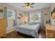 Comfortable bedroom with hardwood floors, a large window, and soft blue accents, creating a relaxing atmosphere at 6325 Yount Dr, Salisbury, NC 28147