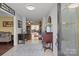 Inviting foyer with neutral tile, an antique table, and access to a spacious living area at 6325 Yount Dr, Salisbury, NC 28147