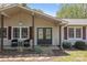 Inviting front porch with double doors, neutral siding, and decorative landscaping at 6325 Yount Dr, Salisbury, NC 28147