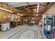Spacious garage workshop featuring exposed rafters, pegboard, and overhead lighting perfect for home projects at 6325 Yount Dr, Salisbury, NC 28147