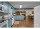 Open kitchen with blue cabinets and granite countertops flows into the dining area at 6325 Yount Dr, Salisbury, NC 28147