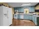 The blue cabinets and granite counters add beauty to this functional kitchen at 6325 Yount Dr, Salisbury, NC 28147