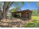 Outdoor shed, with a trailer and equipment, in a fenced in yard at 6325 Yount Dr, Salisbury, NC 28147