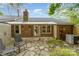 Charming backyard with stone patio, brickwork, and green landscaping providing a relaxing outdoor space at 652 Camrose Ne Cir, Concord, NC 28025