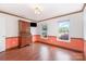 Spacious room with natural light, hardwood floors, and period-style furniture at 652 Camrose Ne Cir, Concord, NC 28025