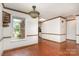 Charming dining area features hardwood floors, decorative lighting, and view of the front yard at 652 Camrose Ne Cir, Concord, NC 28025