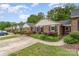 Attractive brick townhomes boasting manicured lawns and mature shrubbery at 652 Camrose Ne Cir, Concord, NC 28025