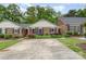 Charming brick home with a well-manicured front yard and ample parking space at 652 Camrose Ne Cir, Concord, NC 28025