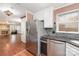 Kitchen with stainless steel appliances and view into adjacent living room at 652 Camrose Ne Cir, Concord, NC 28025